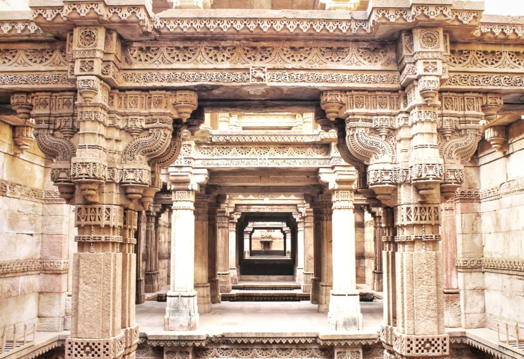 The intricate sandstone carved pillar at Adalaj Step Well