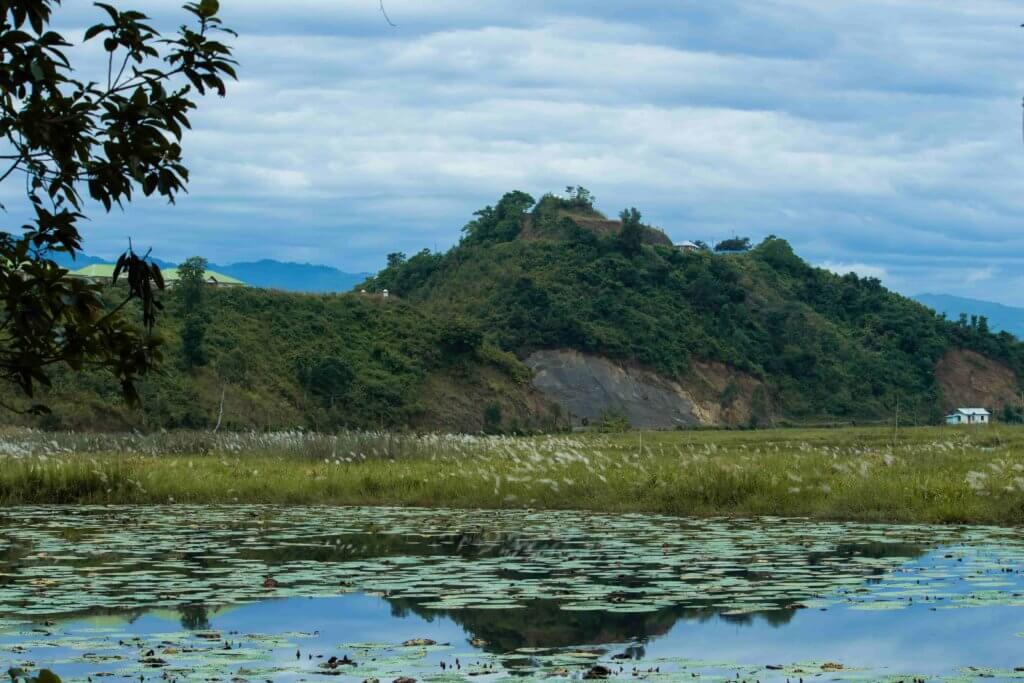 Glassy water of Loktak Lake and fringe villages along the hill