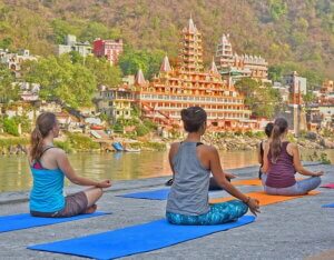 Rishikesh- Yoga capital of India. People practicing yoga in Rishikesh